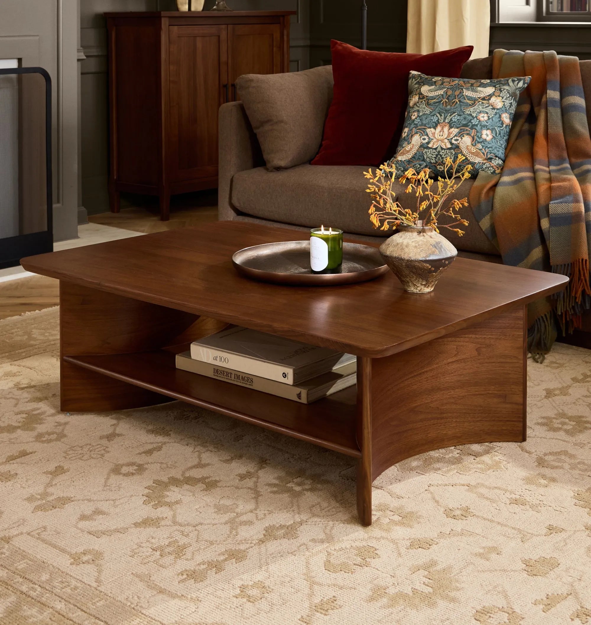 Contemporary Curved Coffee Table with rich wood finish and lower shelf