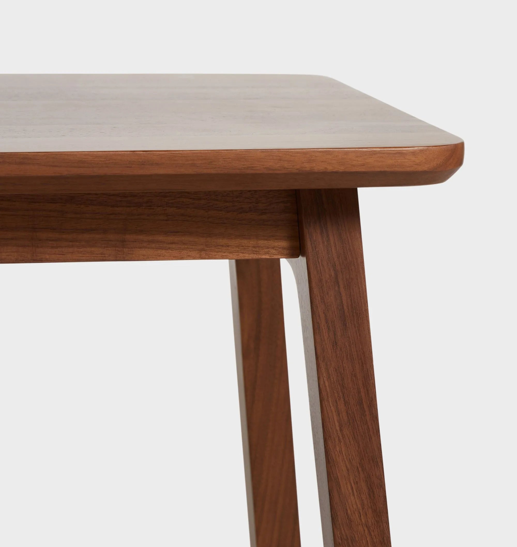 Elegant compact wooden side table with open lower shelf in a cozy room