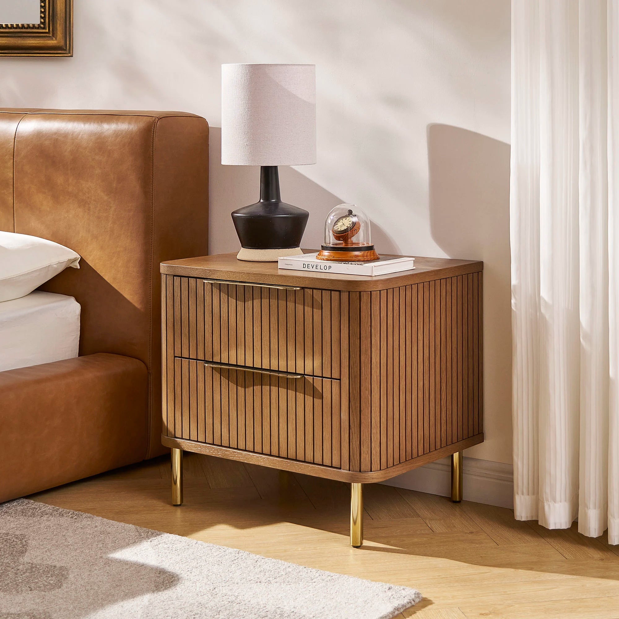 Luxury Nightstand with two drawers, vertical panel design, and gold metal legs in a modern bedroom setting