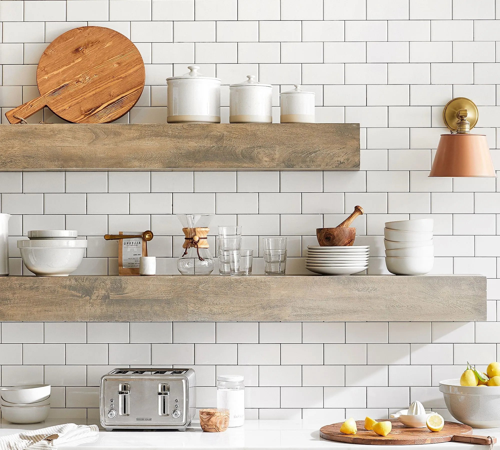 Modern wall shelf with decor items including plants, photos, and vases