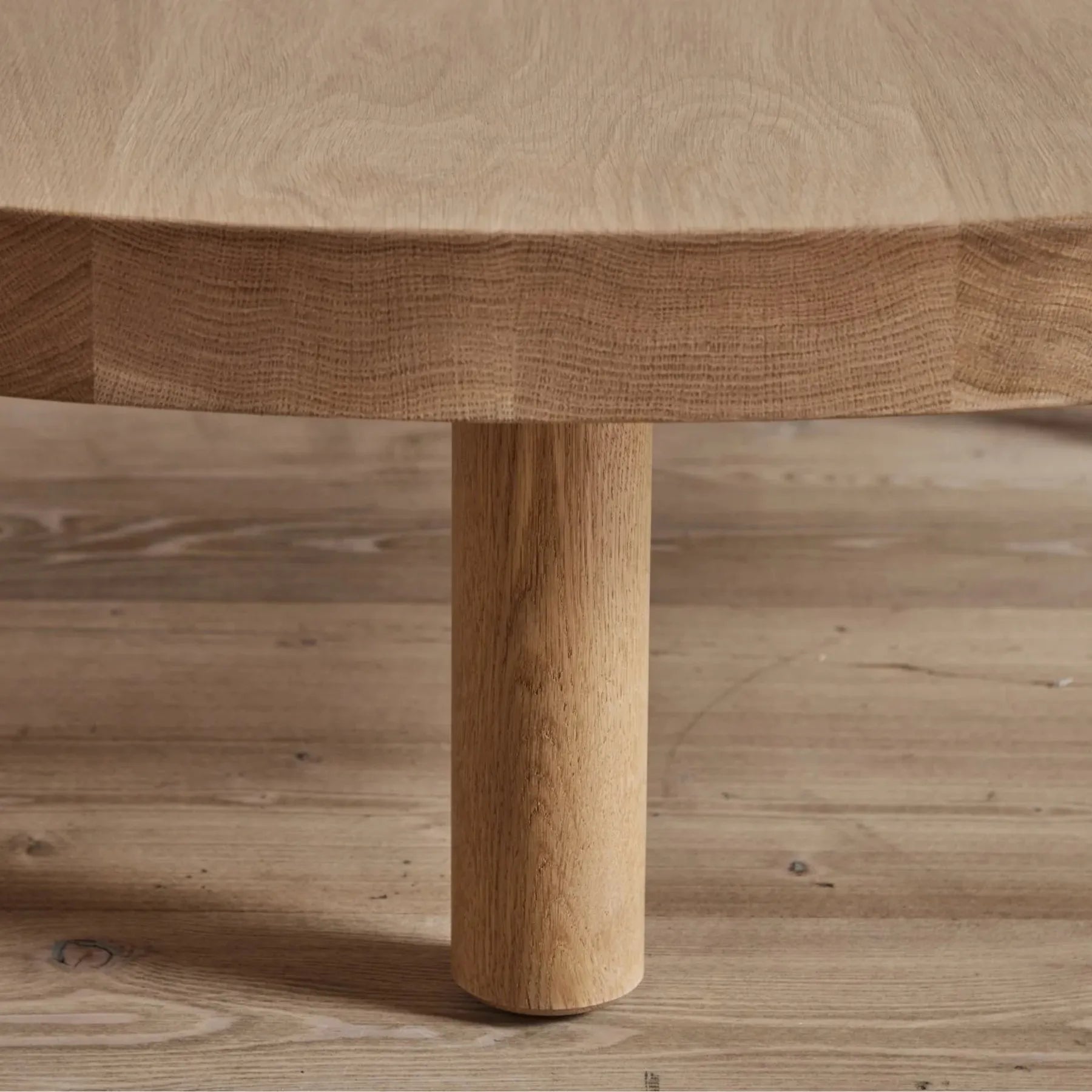 Round Low Profile Coffee Table with cylindrical legs and spacious tabletop
