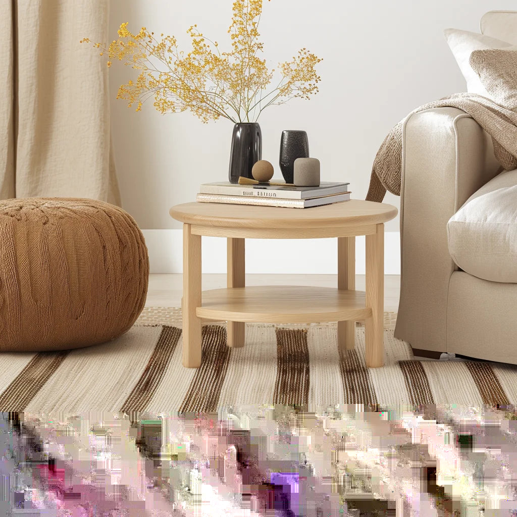 Round side table with shelf placed between two armchairs in neutral room