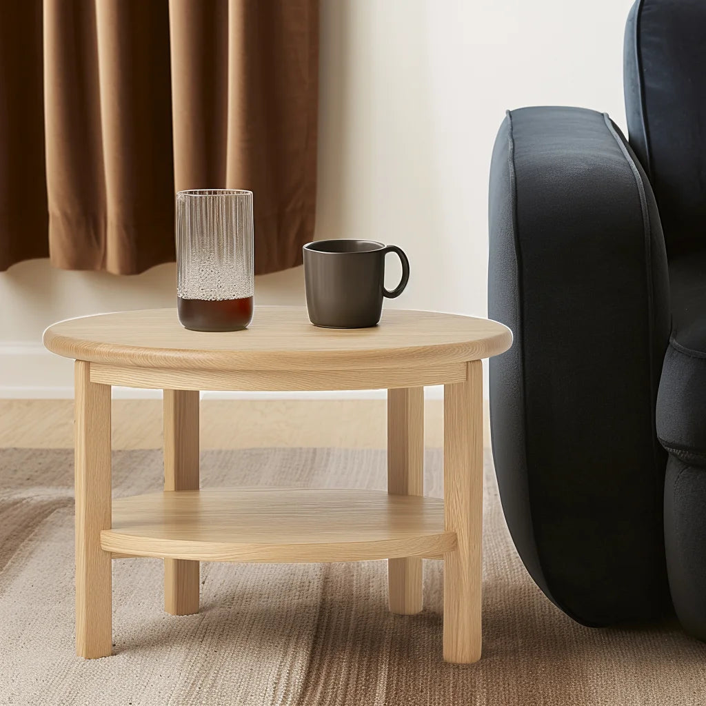 Round side table with shelf placed between two armchairs in neutral room
