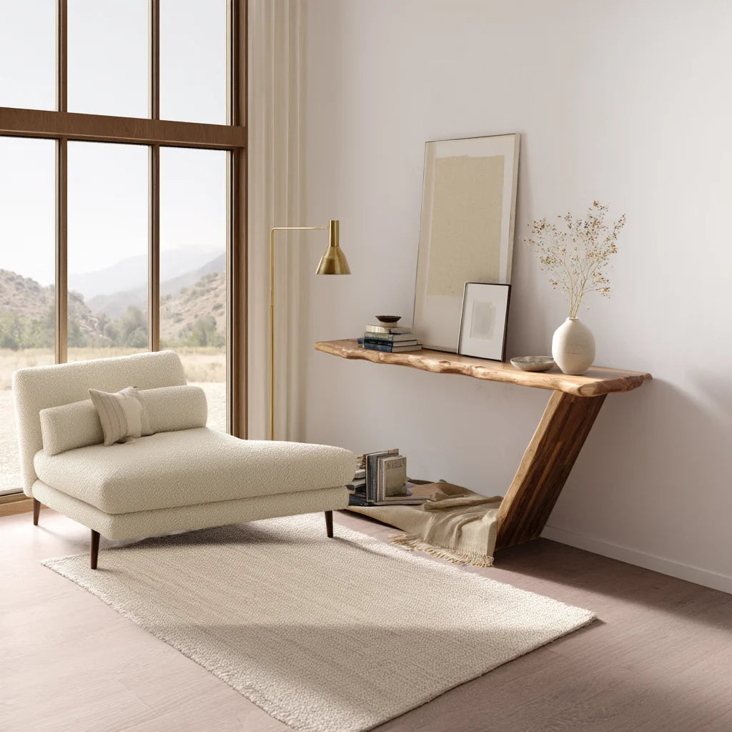 Sculptural console table with asymmetrical leg and open base in modern hallway