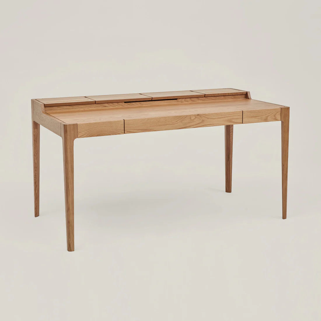 Smart Office Desk with built-in storage compartments and device slots in a modern workspace setting