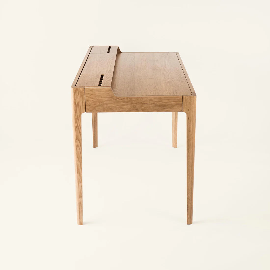 Smart Office Desk with built-in storage compartments and device slots in a modern workspace setting
