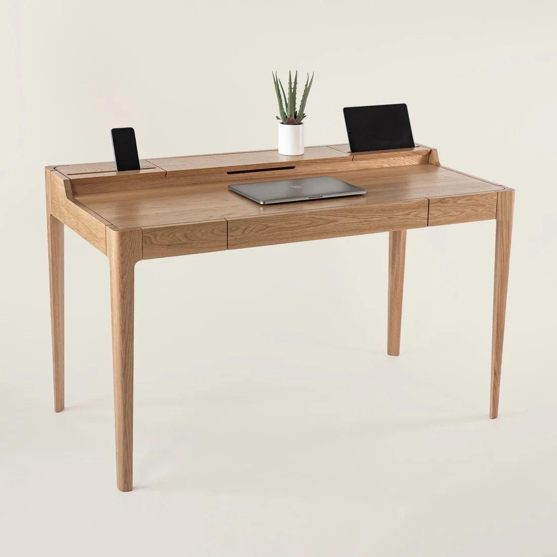Smart Office Desk with built-in storage compartments and device slots in a modern workspace setting