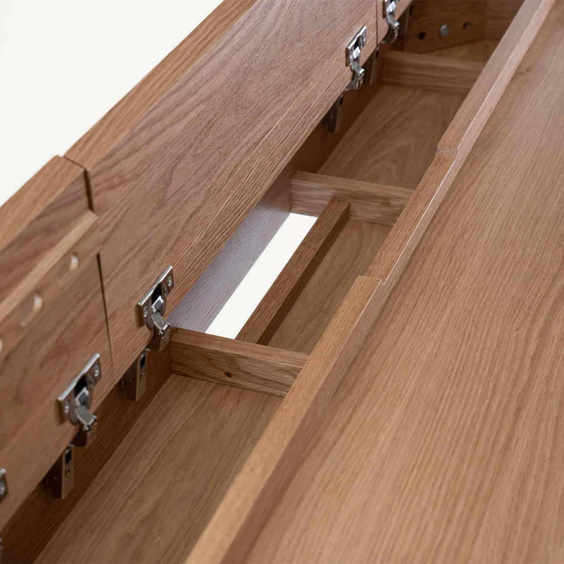 Smart Office Desk with built-in storage compartments and device slots in a modern workspace setting