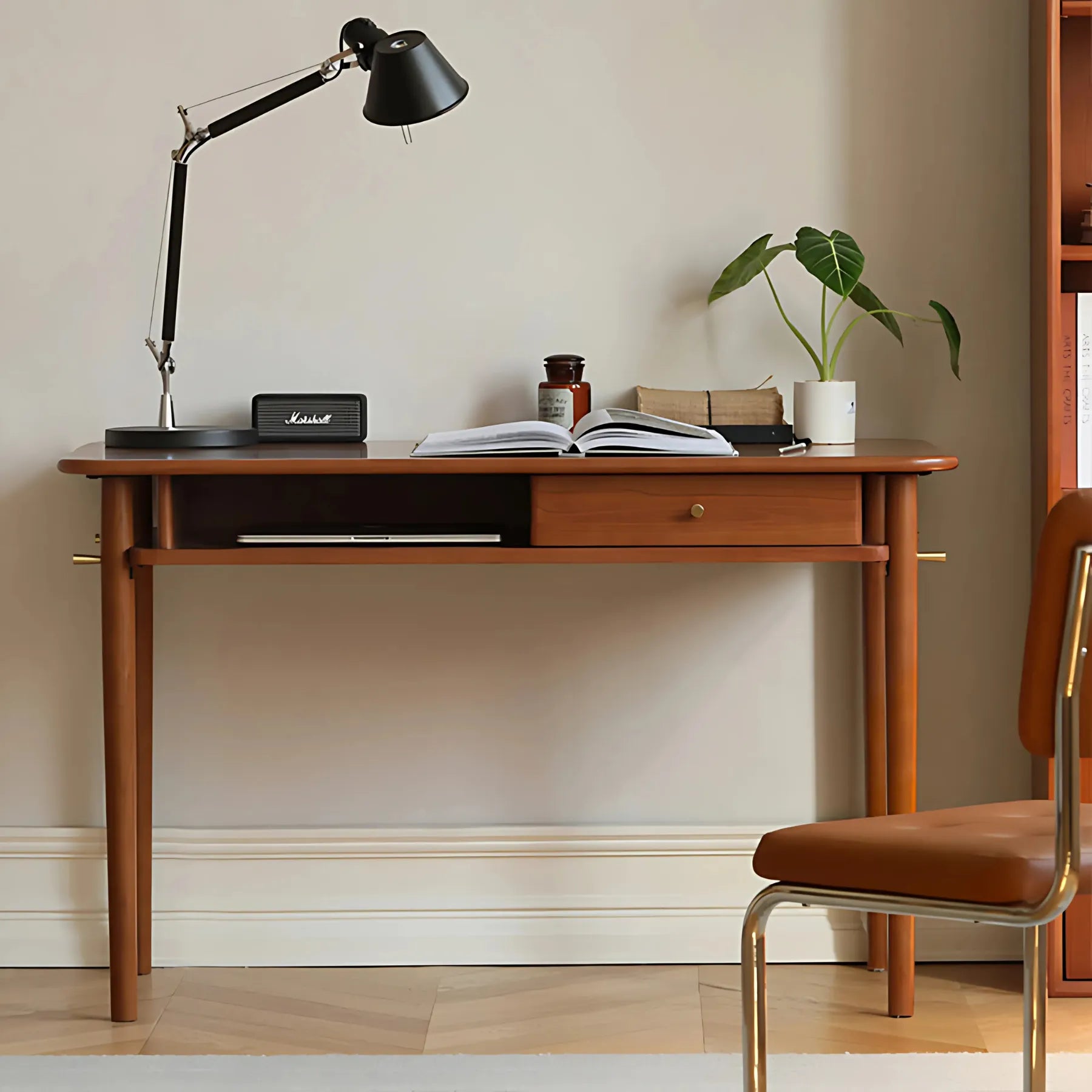 Stylish home office desk with drawer and open shelf.