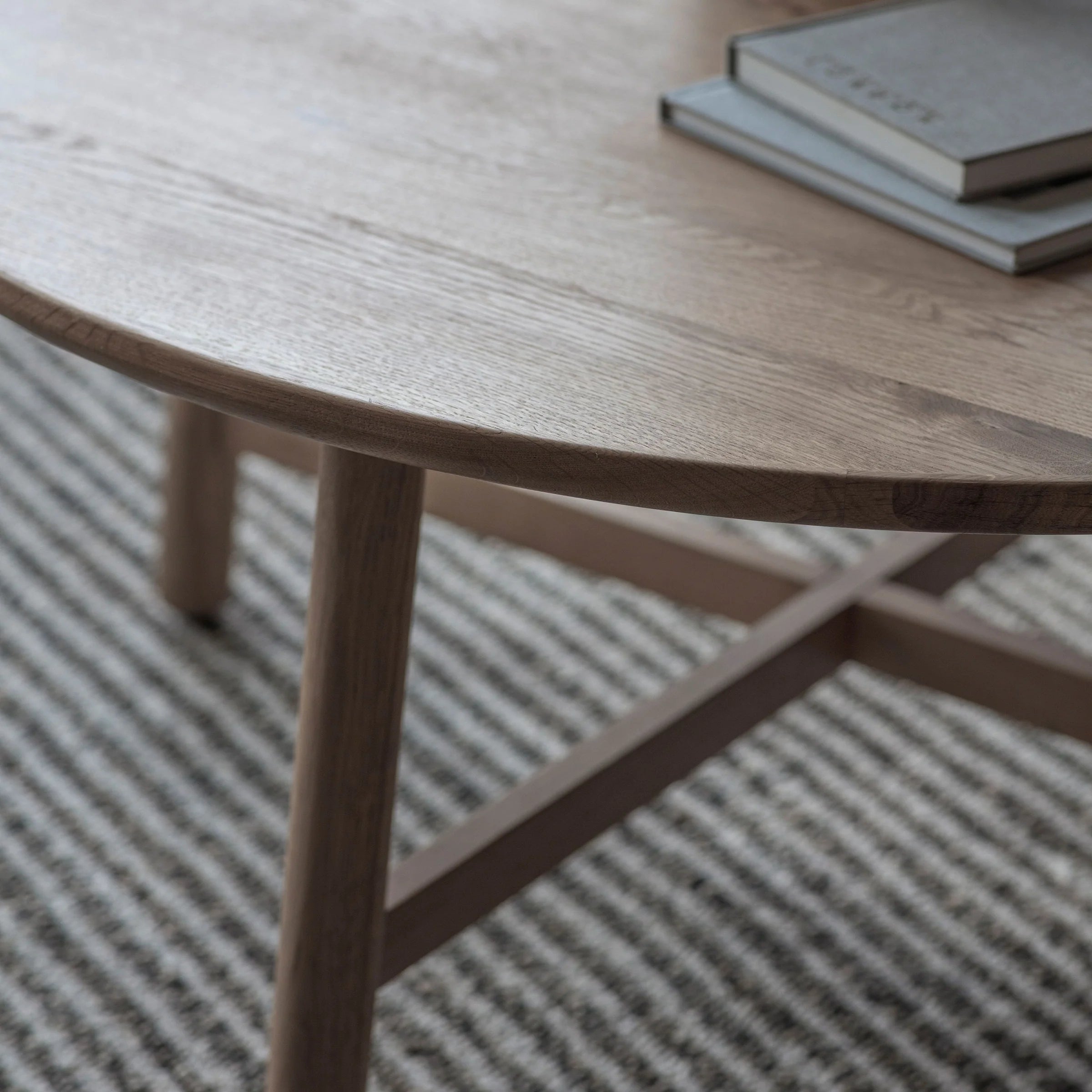 Timeless Round Coffee Table with raised edges and cross base