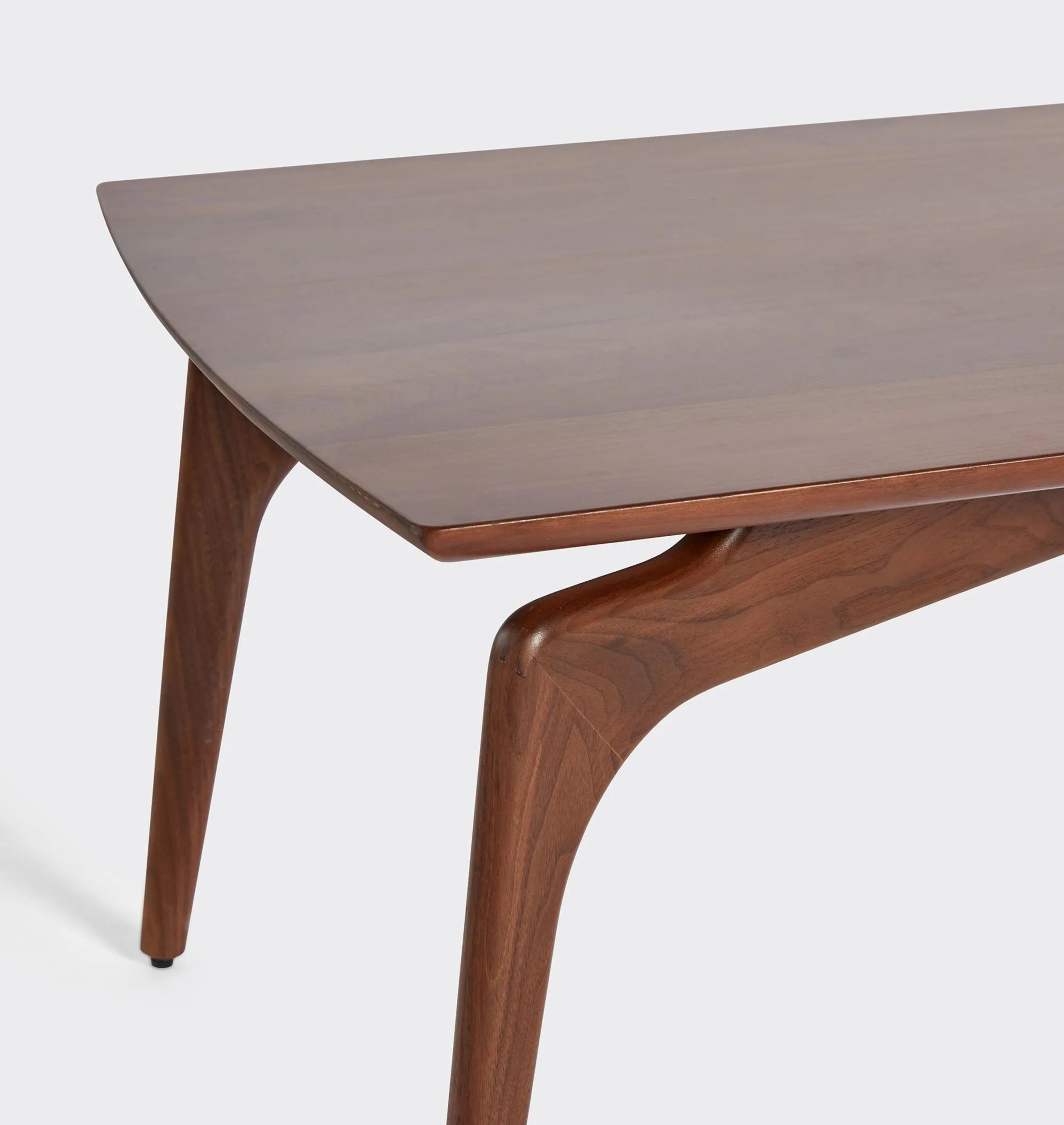 Timeless mid century coffee table with curved edges and tapered legs.
