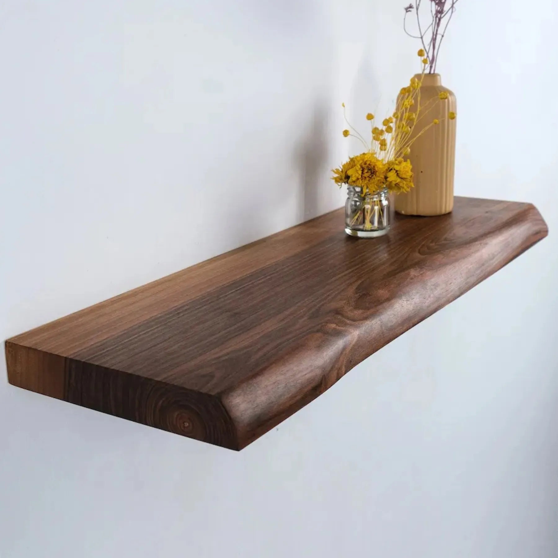 Wall mounted shelf natural edge floating design with decorative items