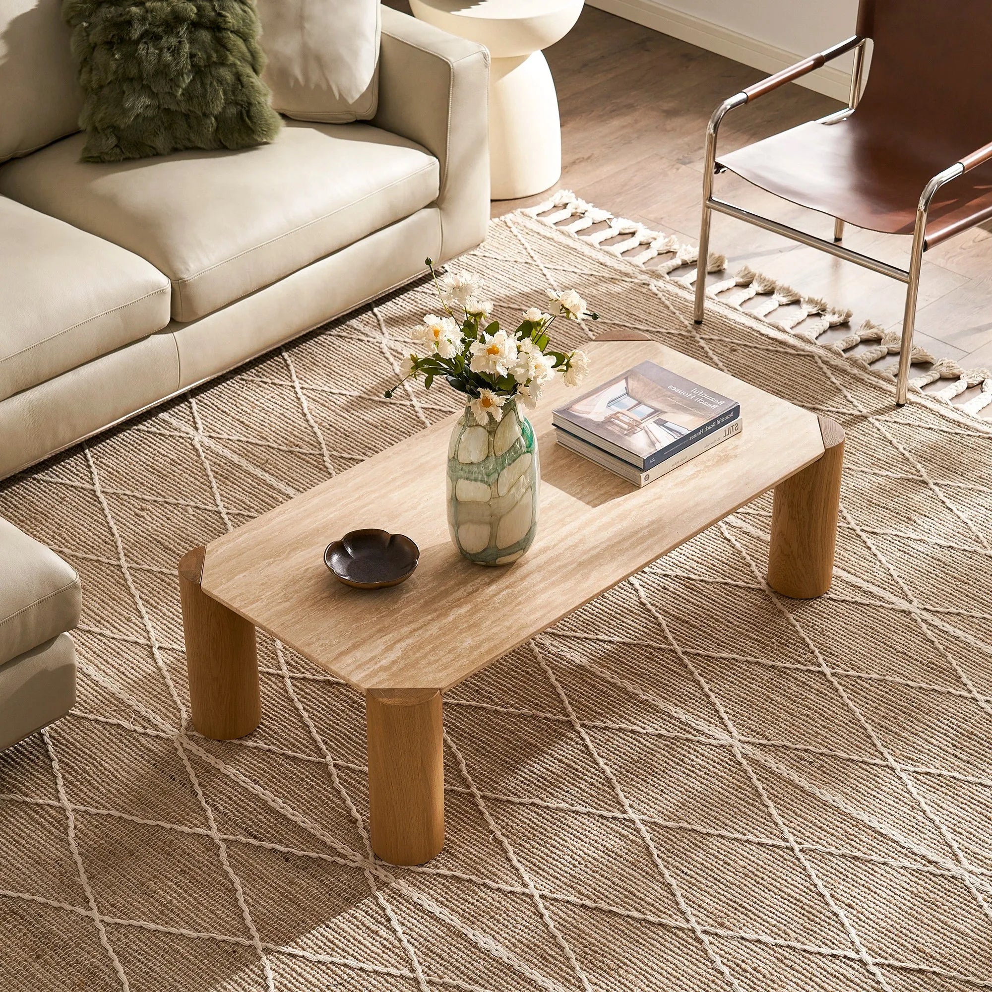Rectangular modern coffee table with cylindrical legs and sleek design