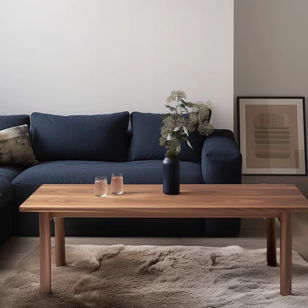 Refined coffee table with smooth edges and minimalist design in a dark blue modern living room