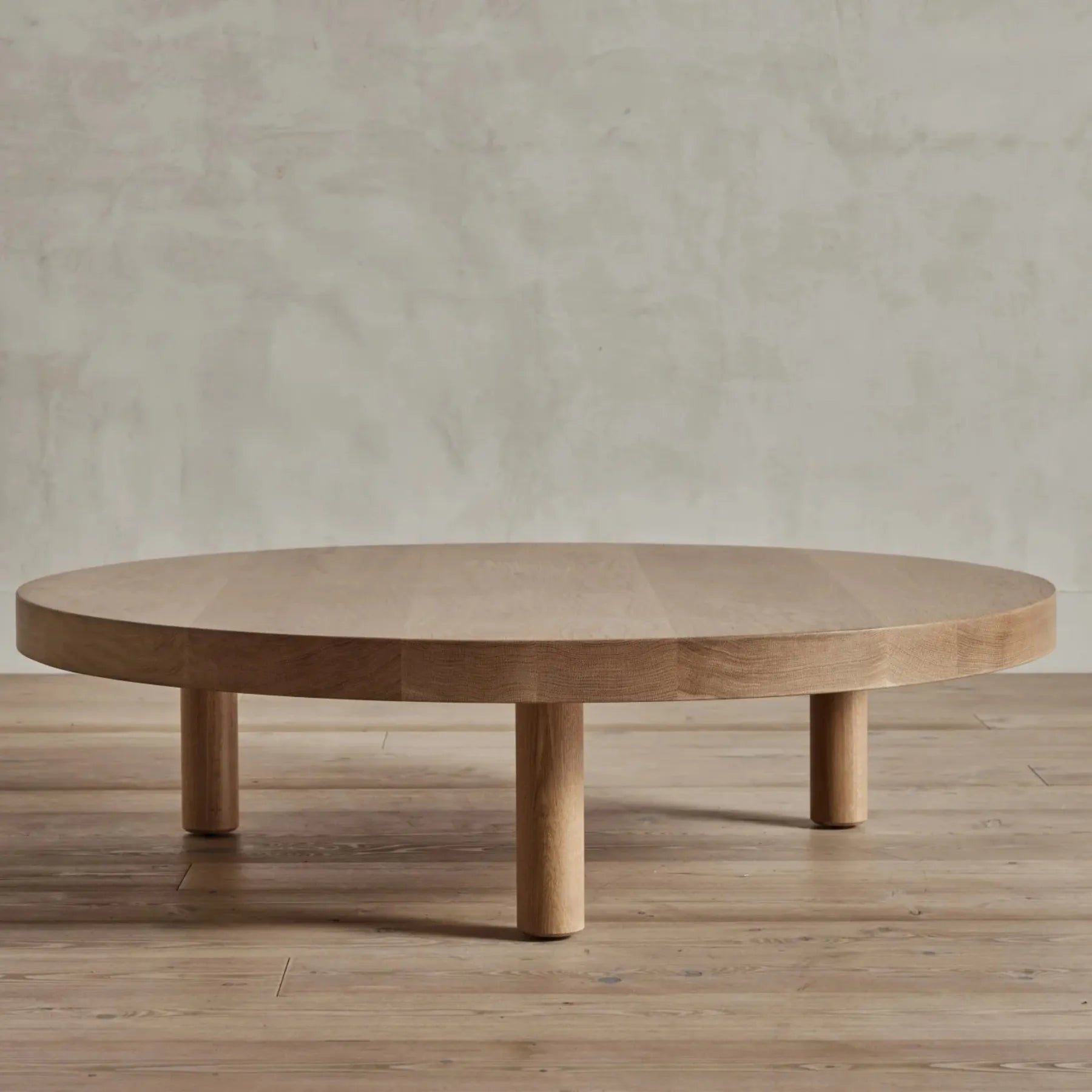 Round Low Profile Coffee Table with cylindrical legs and spacious tabletop