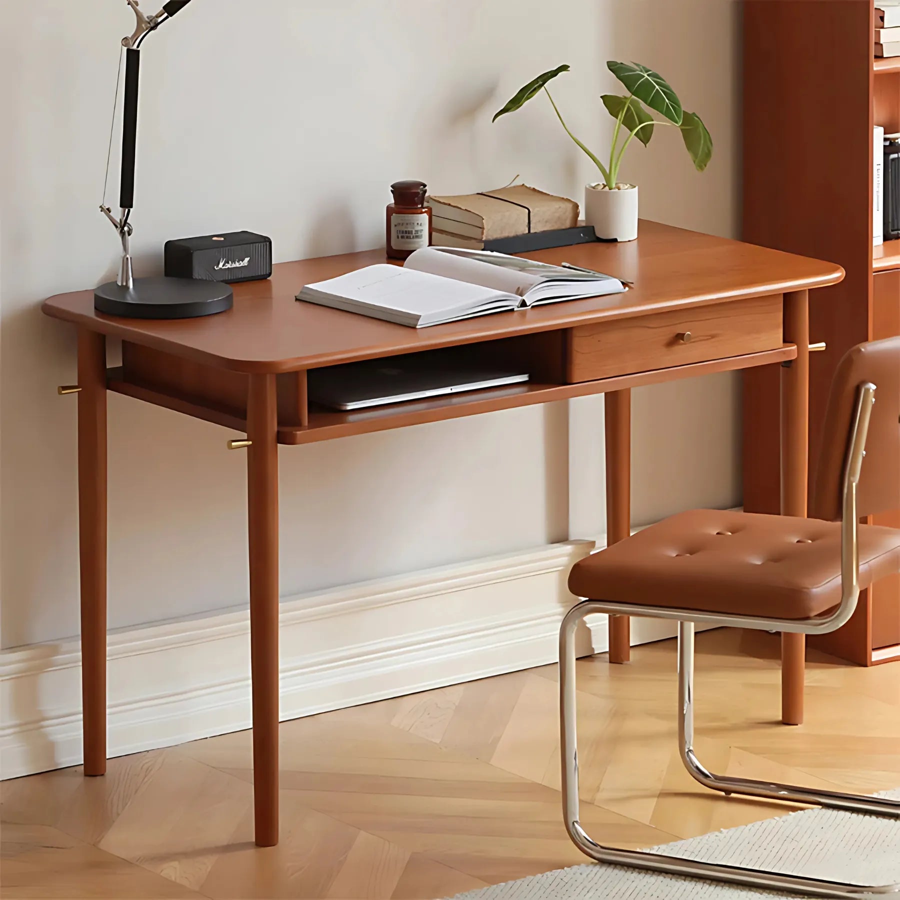Stylish home office desk with drawer and open shelf.