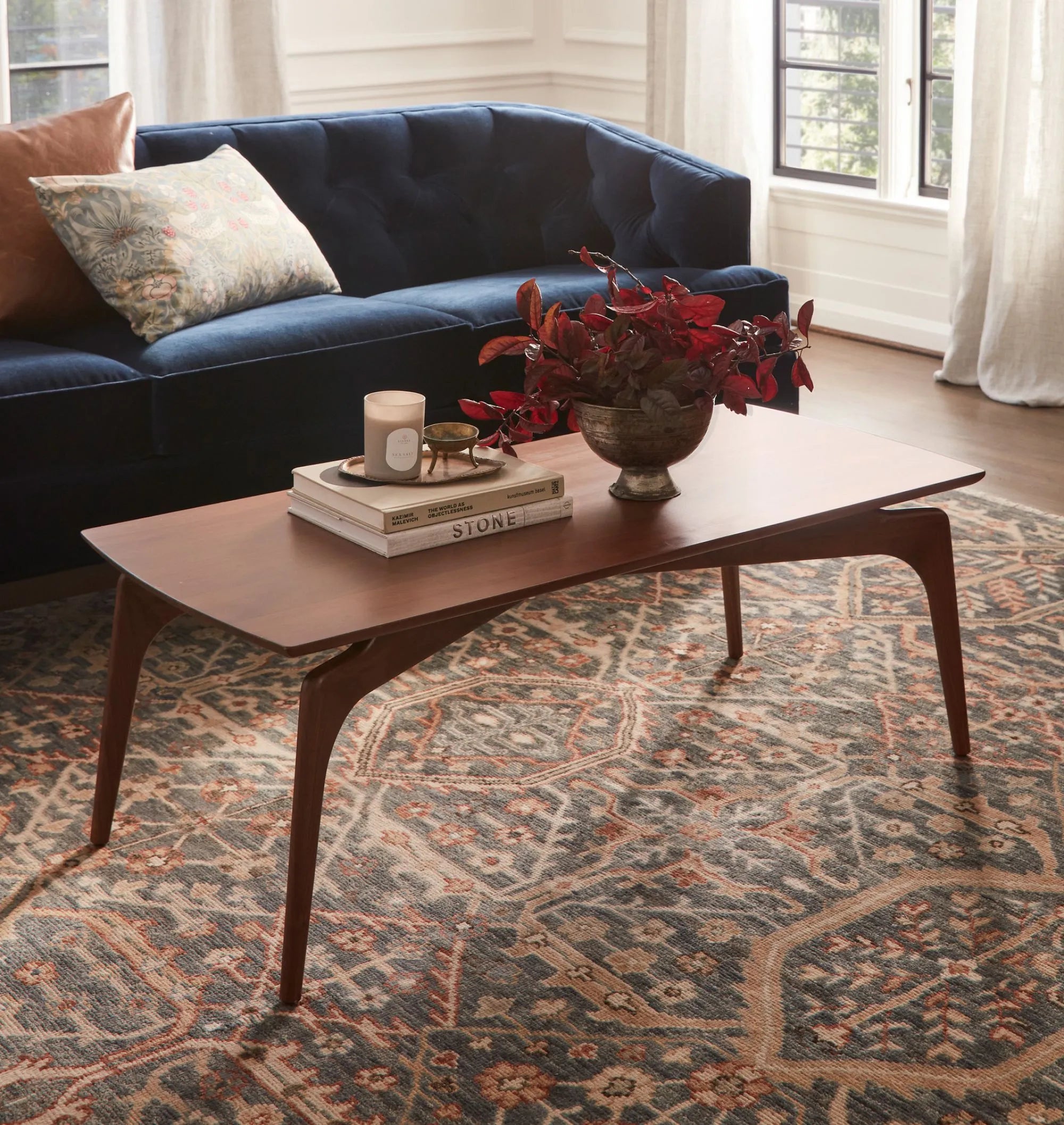 Timeless mid century coffee table with curved edges and tapered legs.