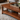 Modern Natural Wood Coffee Table With Open Shelf And Slatted Side Panels For Living Room
