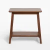 Elegant compact wooden side table with open lower shelf in a cozy room