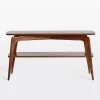 Mid century console table with curved edges, tapered legs, and two spacious shelves.