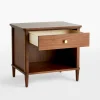 Mid century nightstand with open shelf, single drawer, and brass knob.