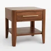 Mid century nightstand with single drawer, open shelf, and tapered legs.