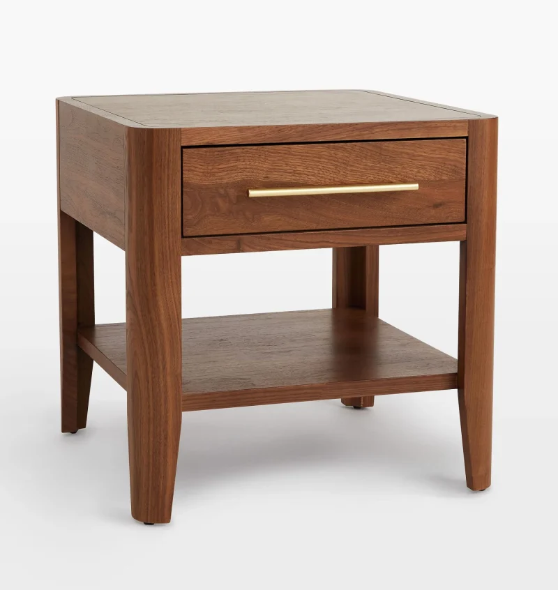 Mid century nightstand with single drawer, open shelf, and tapered legs.