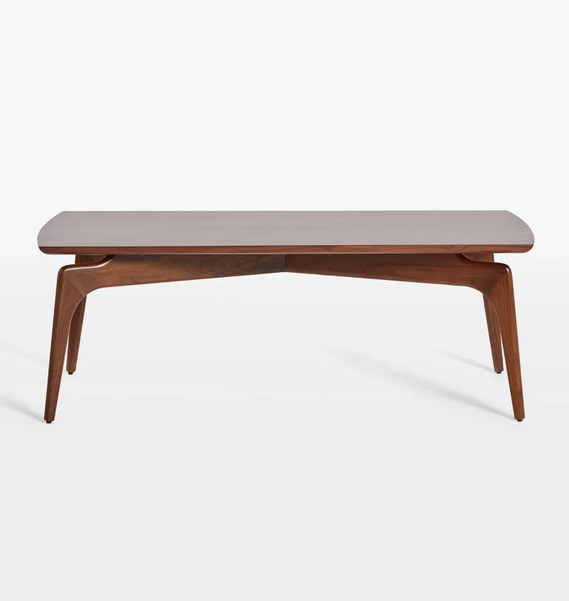 Timeless mid century coffee table with curved edges and tapered legs.