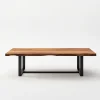 Industrial live edge coffee table with metal base and natural wood top.