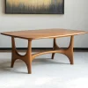 Midline coffee console centered in minimal lounge setting under warm filtered light