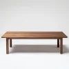Refined coffee table with smooth edges and minimalist design in a dark blue modern living room